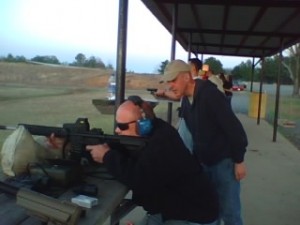 03-17-09_1921 Larry Pogue sites his M4 variant as Micah Hall makes suggestions.