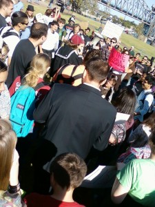 The group reads the preamble to the U.S. Constitution prior to marching. (Photo by Sitton)