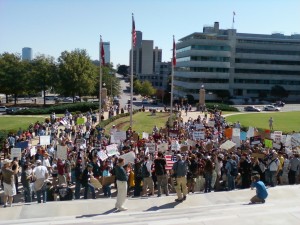 Protesters gather near the steps the State Capitol, but stay off the grounds. (photo by Sitton)