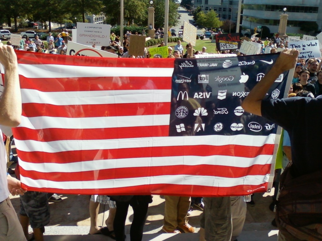 This American flag features corporate logos instead of stars. (photo by Sitton)